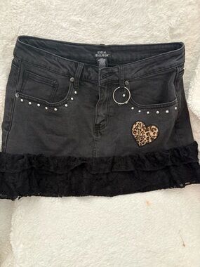 Social Collisions Black Denim Mini Skirt with Leopard Heart Patch